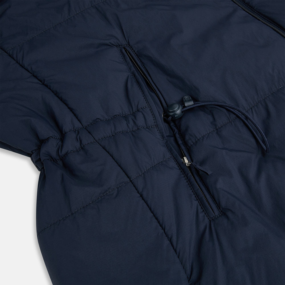 A Navy John Arthur Trench Coat by Turnbull & Asser, featuring a collar, button closure, adjustable cuff straps, two slanted front pockets, and a chest zip pocket, is displayed flat on a white background.