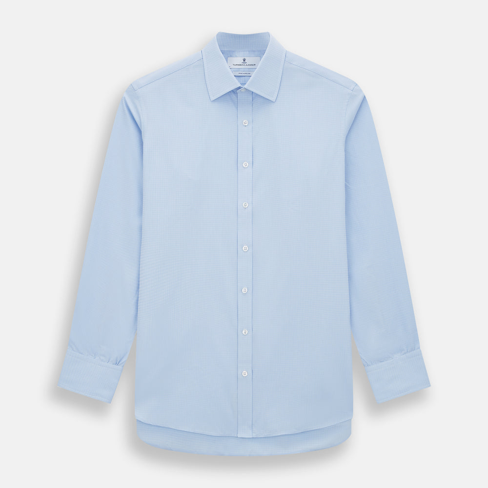 The Pale Blue Rhombus Mayfair Shirt by Turnbull & Asser features long sleeves, a classic collar, white buttons, and buttoned cuffs, shown laid flat on a white background.
