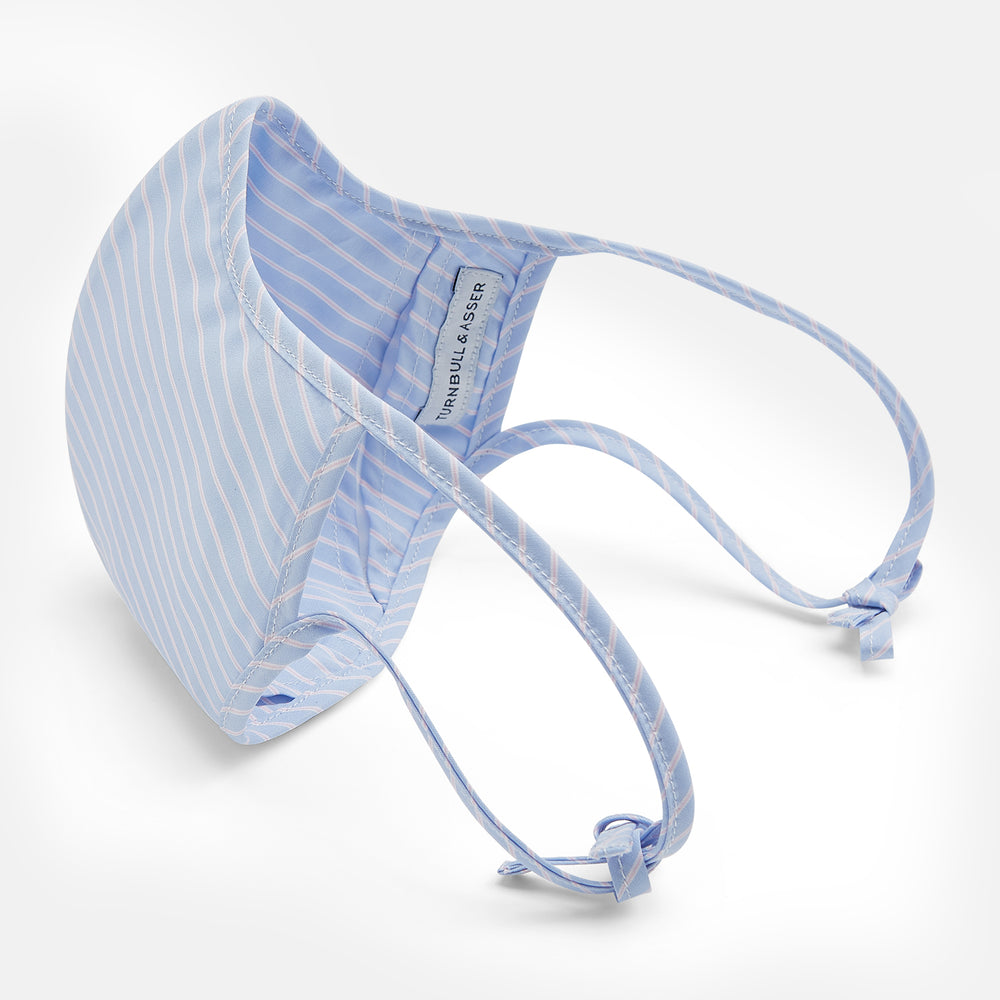 Turnbull & Asser's Exclusive Light Blue, White & Pink Stripe Commuter Mask features ear loops tied in bows and includes 3 VIROFORMULA™ filters for enhanced protection and comfort.