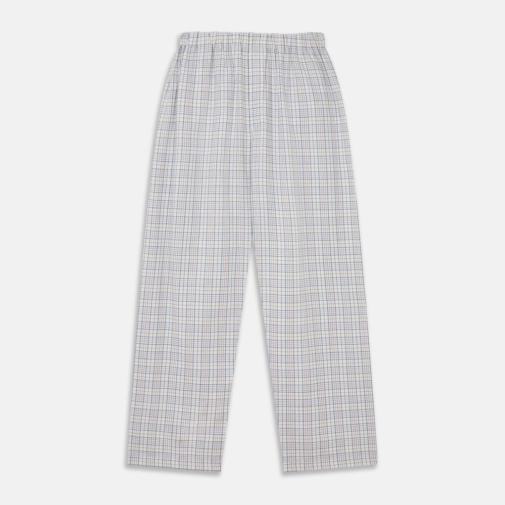 The Turnbull & Asser Blue Multi Check Cotton-Cashmere Modern Pyjama Set features a two-piece design with a long-sleeve button-up top with breast pocket and matching elastic-waist pants in a blue and white check pattern.
