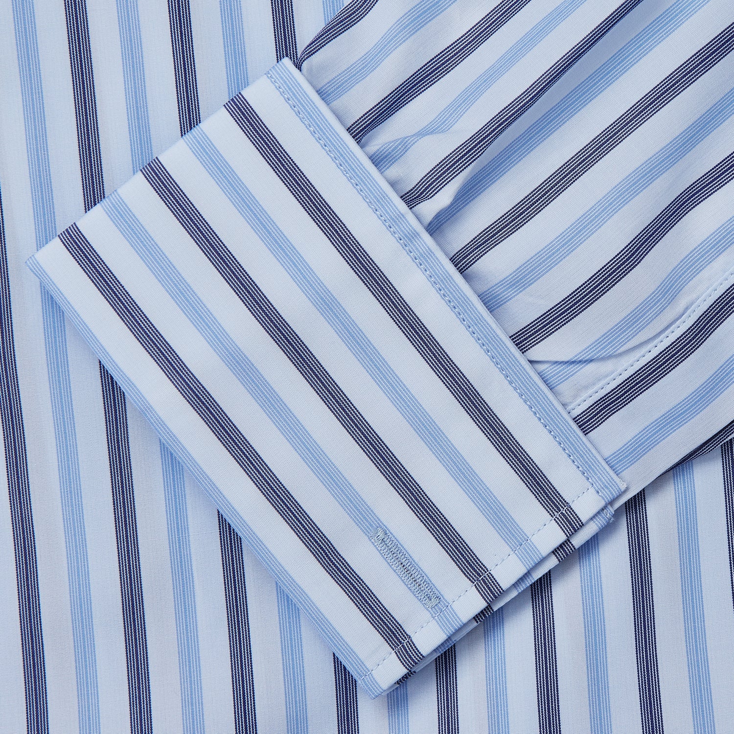 View 3 of product The Turnbull & Asser Pale Blue Multi Stripe Cotton Regular Fit Whitby Shirt, with collar and cuffs, is shown laid flat on a white background.