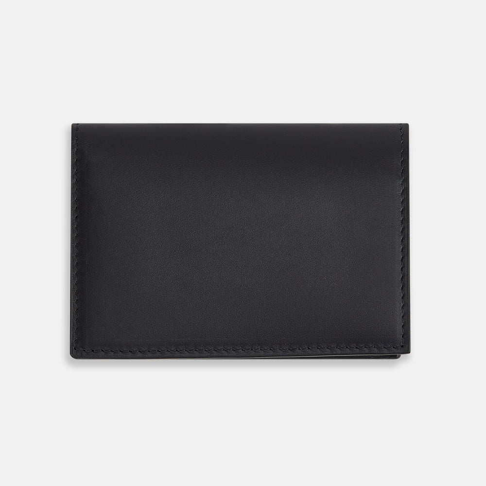 A navy full-grain leather bi-fold card holder with neat stitching and "Turnbull & Asser" embossed in white near the bottom center.