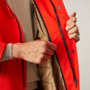 View 6 of product Wearing the Turnbull & Asser Red Walter Sealup Parka with Detachable Liner, black pants, and white sneakers, a person stands in profile against a plain light background—perfect for travel.