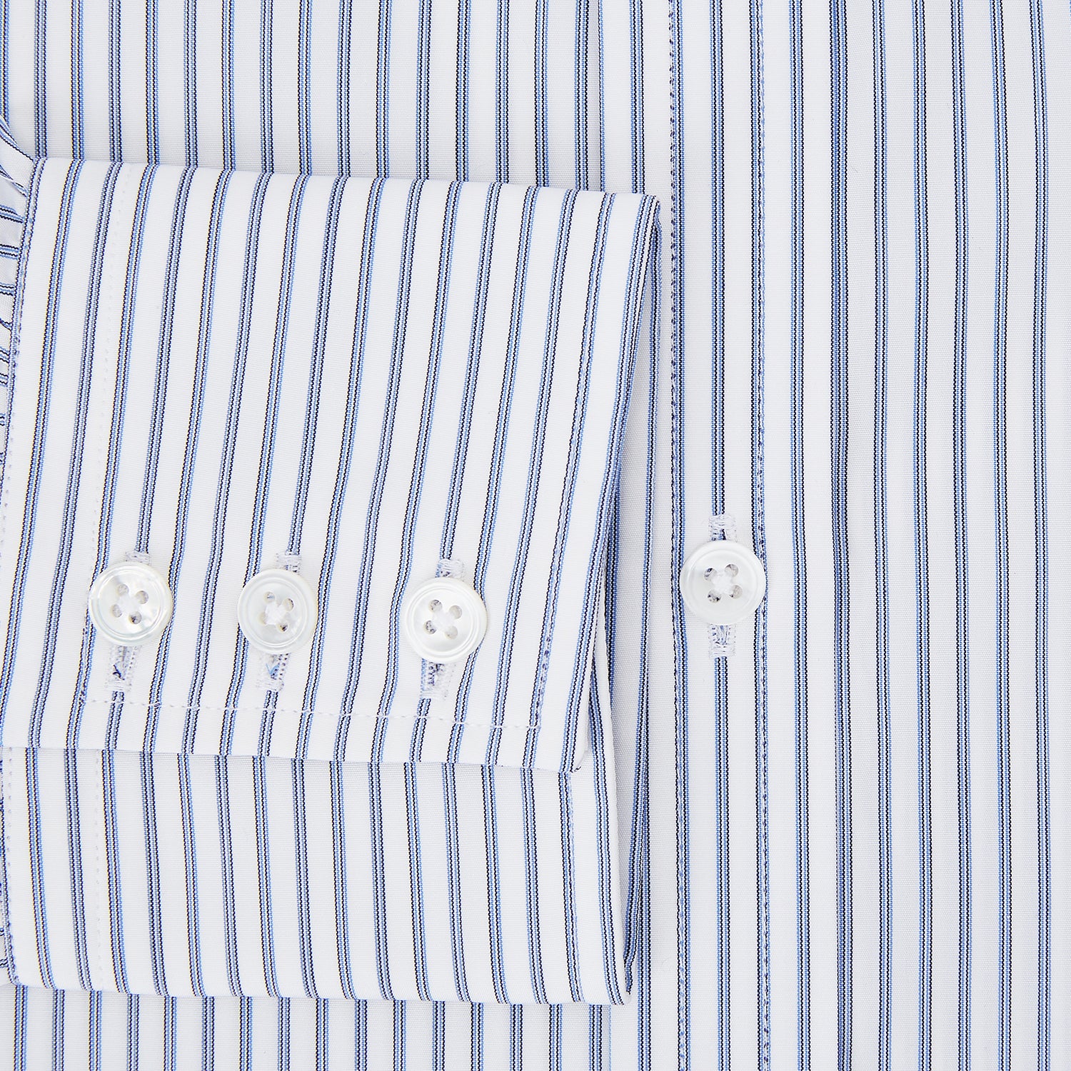 View 4 of product The Turnbull & Asser Navy Double Pinstripe Mayfair Shirt is a long-sleeve, button-up collared shirt with thin vertical blue and white stripes, shown against a plain white background.