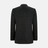 View 3 of product The Turnbull & Asser Charcoal Glen Check Sports Jacket features a dark plaid pattern, single-button closure, notched lapels, and two front flap pockets, shown against a plain white background—an essential for any men's wardrobe.