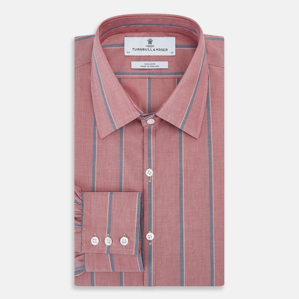 The Turnbull & Asser Red Track Stripe Westminster Shirt features British craftsmanship, a collar, pink base with vertical blue and white stripes, white buttons, and a pocket-free front for refined appeal.