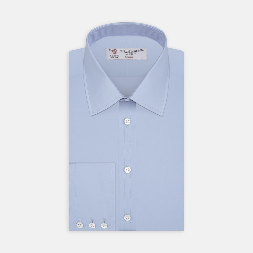 A circular swatch of Turnbull & Asser Blue Cotton Fabric with a subtle texture is shown on a plain white background, outlined by a thin gray border.