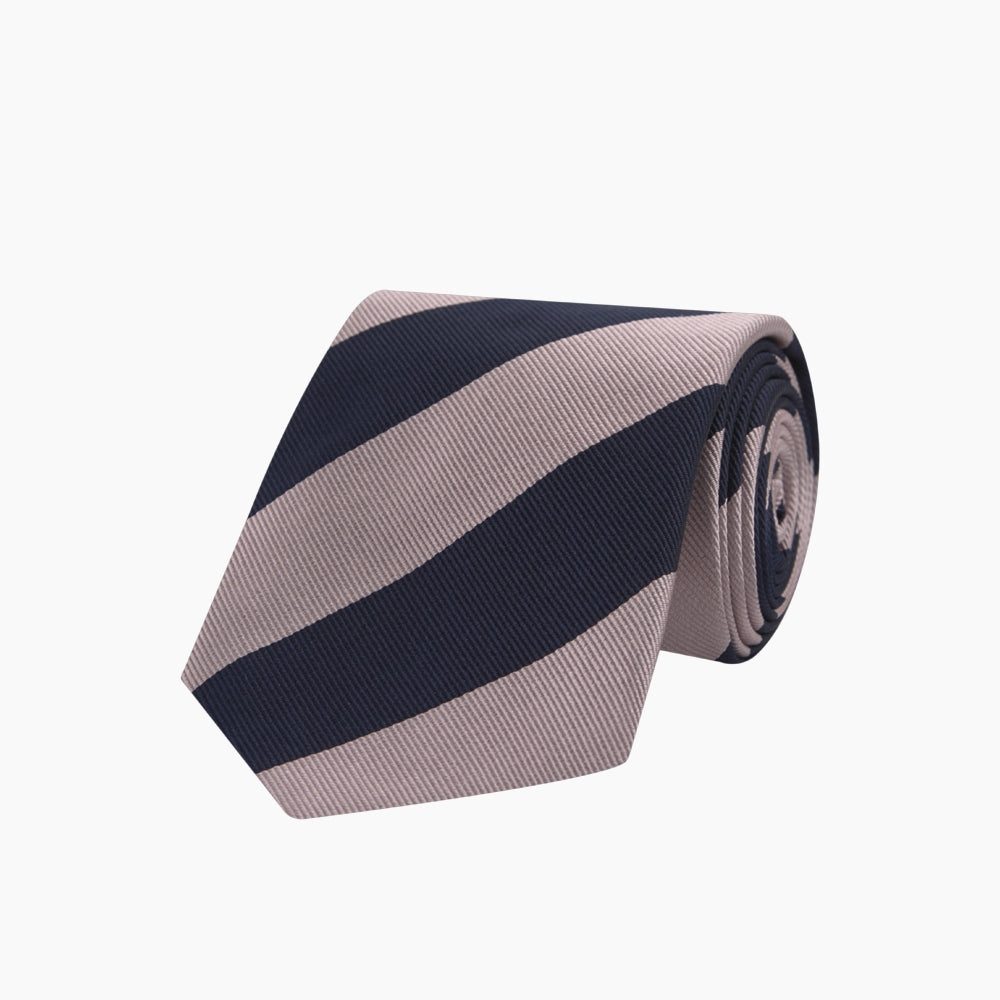 The Turnbull & Asser Navy and Rose Block Stripe Repp Silk Tie, crafted from luxurious silk, features bold diagonal stripes and is displayed rolled up on a plain white background.