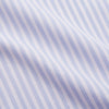 View 4 of product The Turnbull & Asser Lilac Stripe Cotton Regular Fit Mayfair Shirt features thin white and lilac stripes, a T&A collar, and buttoned cuffs, shown laid flat on a white background.