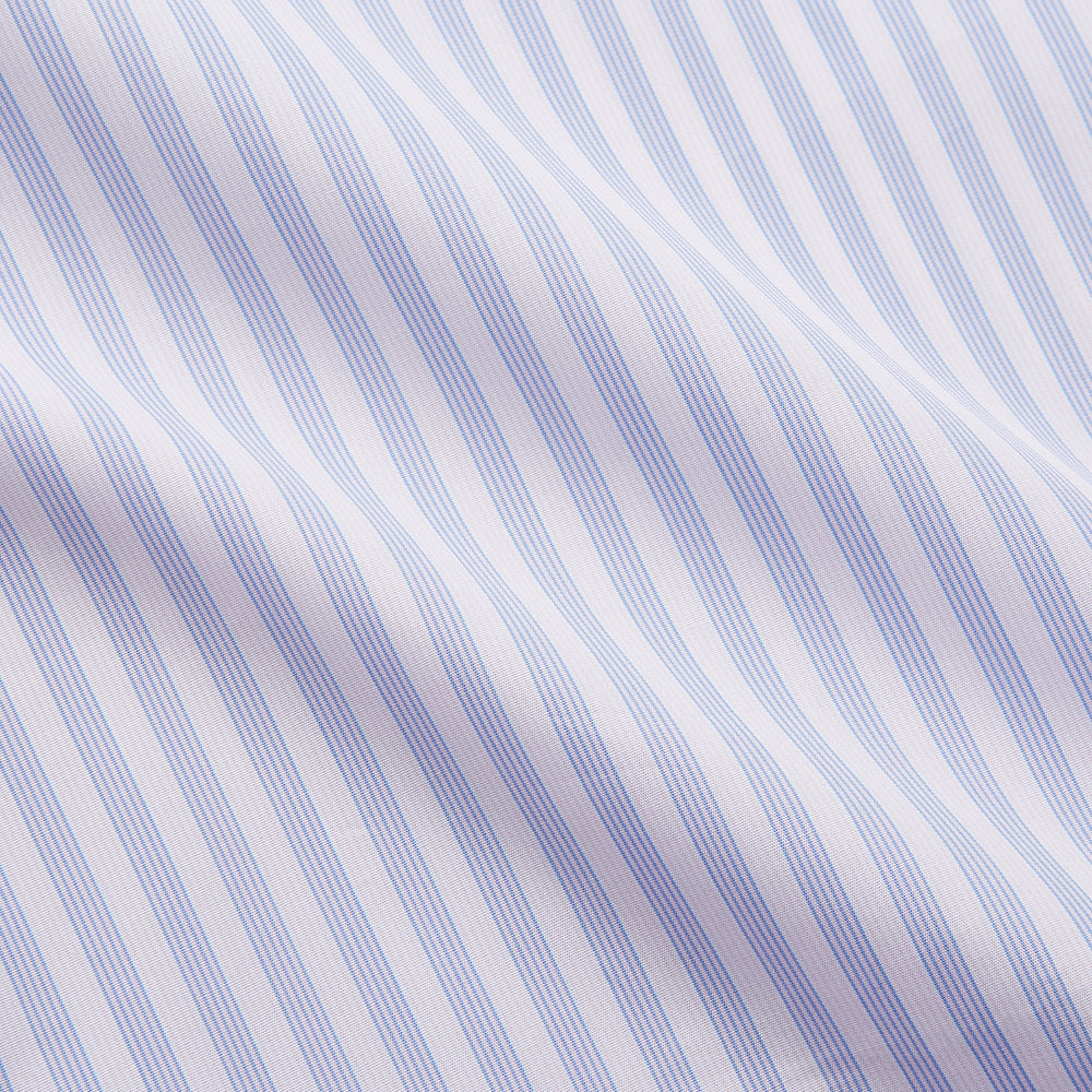 The Turnbull & Asser Lilac Stripe Cotton Regular Fit Mayfair Shirt features thin white and lilac stripes, a T&A collar, and buttoned cuffs, shown laid flat on a white background.