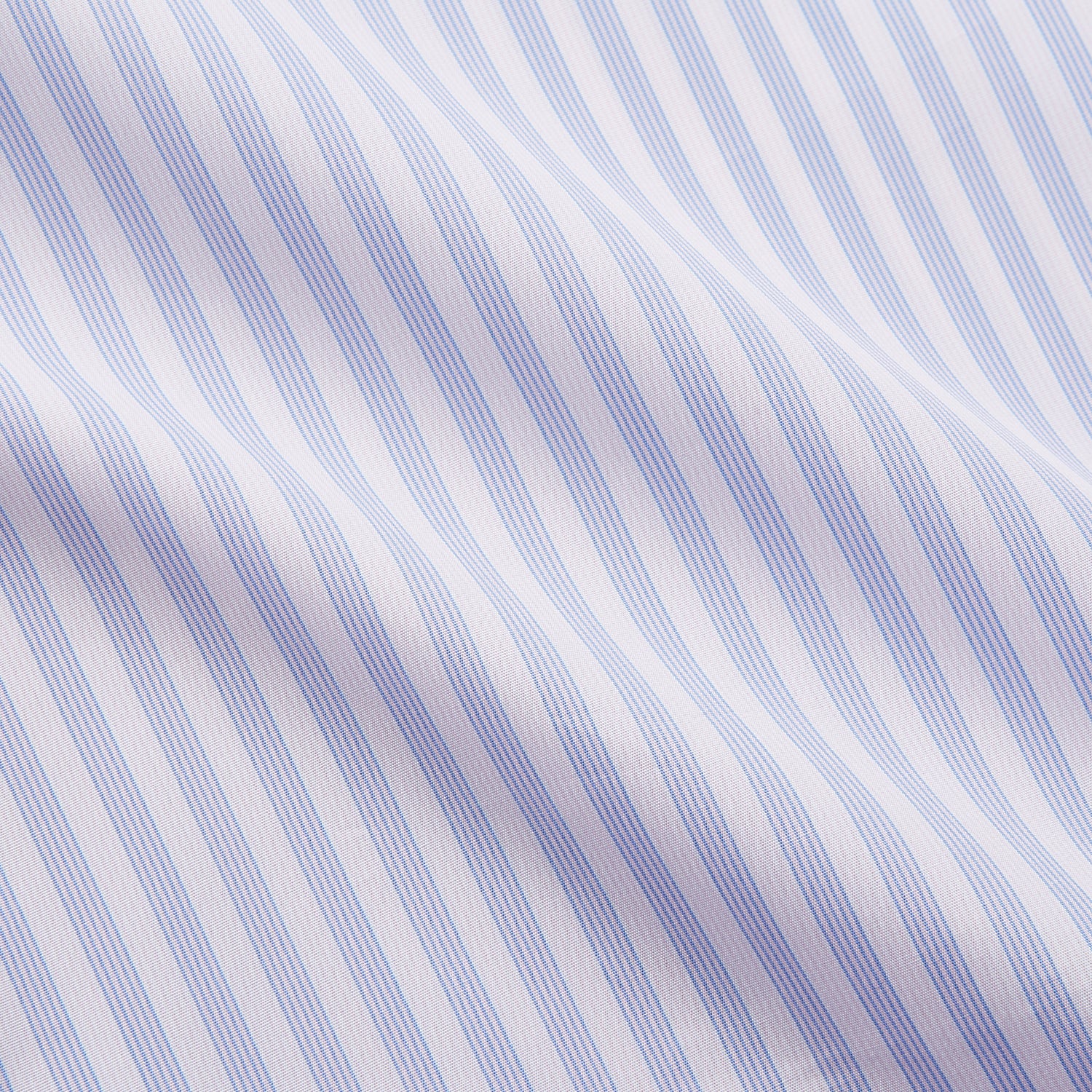 View 4 of product The Turnbull & Asser Lilac Stripe Cotton Regular Fit Mayfair Shirt features thin white and lilac stripes, a T&A collar, and buttoned cuffs, shown laid flat on a white background.