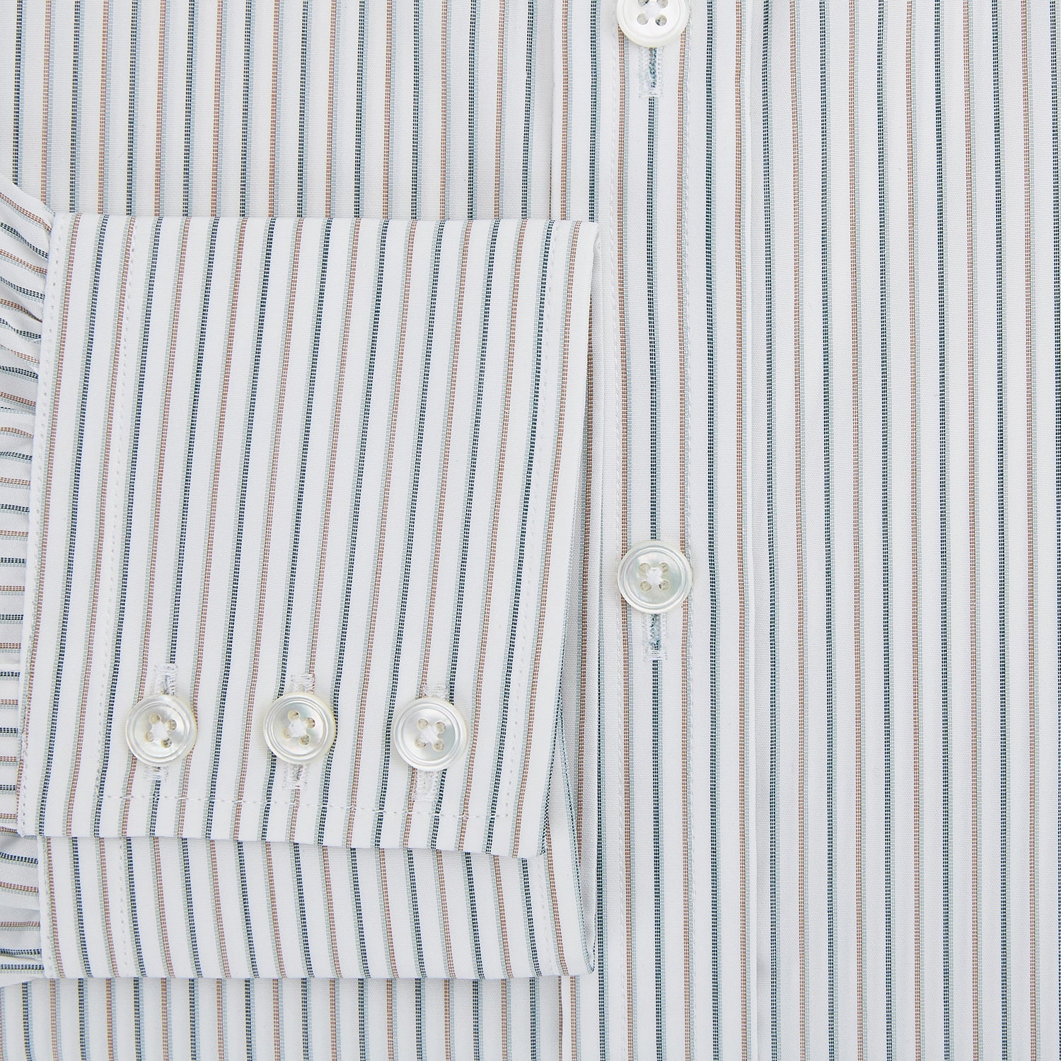 View 4 of product The Teal Double Stripe Mayfair Shirt by Turnbull & Asser is a long-sleeved, button-up shirt with thin teal stripes, a pointed collar, and buttoned cuffs—an essential piece for any gentleman’s wardrobe, shown laid flat on a white background.
