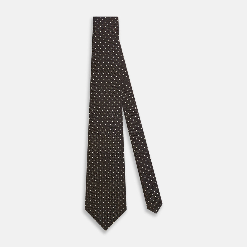 The Turnbull & Asser White and Brown Micro Dot Silk Tie features a refined micro dot pattern—an essential accessory for any men's wardrobe.