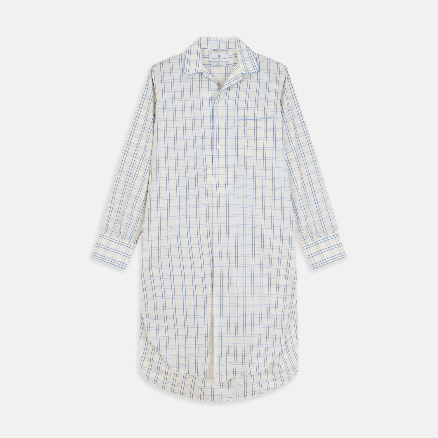 View 1 of product The Turnbull & Asser Cream Multi Cotton Sussex Nightshirt is a knee-length, long-sleeve shirt dress with a blue and beige plaid pattern, collar, front button placket, chest pocket, and rounded hem with side slits.