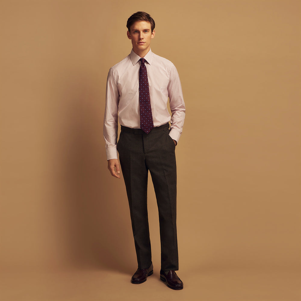 The Turnbull & Asser Burgundy Stripe West Indian Sea Island Cotton Regular Fit Mayfair Shirt features thin vertical red and white stripes, a classic collar, and long sleeves, shown on a plain white background.
