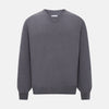 View 1 of product The Grey V-Neck Cashmere Jumper by Turnbull & Asser features long sleeves, ribbed cuffs and hem, in dark gray cashmere, shown against a white background.