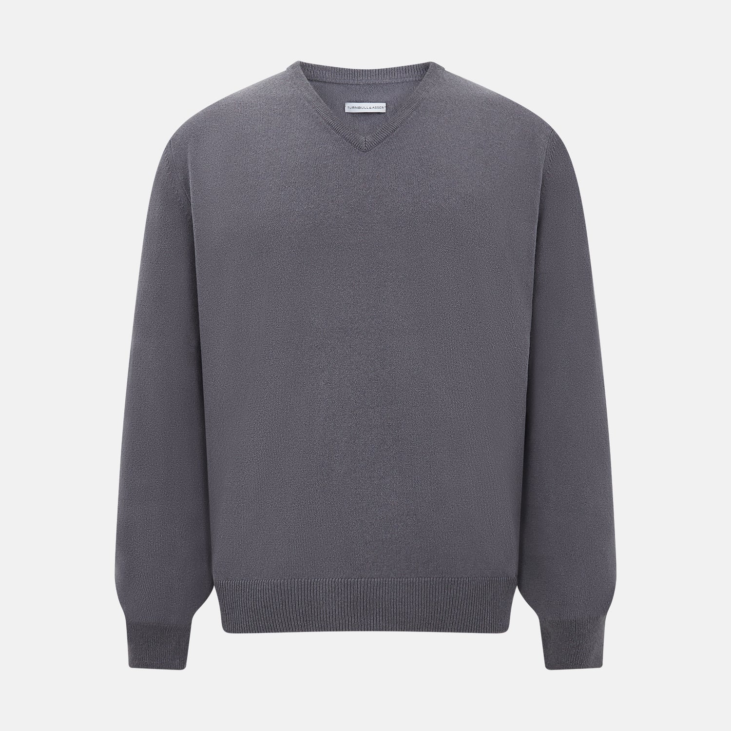 View 1 of product The Grey V-Neck Cashmere Jumper by Turnbull & Asser features long sleeves, ribbed cuffs and hem, in dark gray cashmere, shown against a white background.