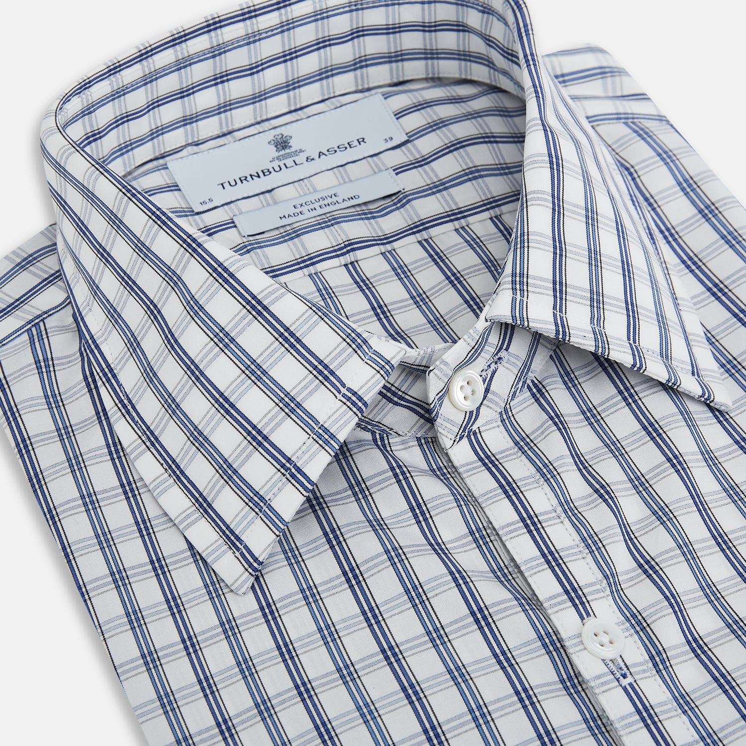 View 2 of product The Azzurro Multi Check Westminster Shirt by Turnbull & Asser is a long-sleeve, button-up with a white base and blue and gray checks, displayed flat against a white background.