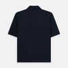 View 3 of product The Turnbull & Asser Navy Polo Shirt features short sleeves, a collar, three-button placket, and a single buttoned chest pocket, shown flat on a plain white background.