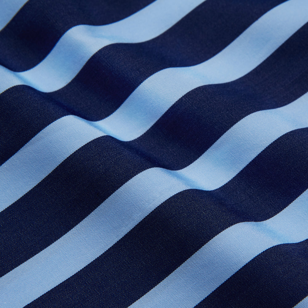 The Turnbull & Asser Navy Multi Stripe Cotton Weekend Fit Suffolk Shirt features vertical blue and navy stripes, a chest pocket, buttoned cuffs, and a classic buttoned Dorset collar.