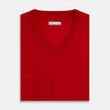 View 4 of product The Turnbull & Asser Red Fine Merino V-Neck Jumper, a classic long-sleeve knitwear piece, is shown on a white background.