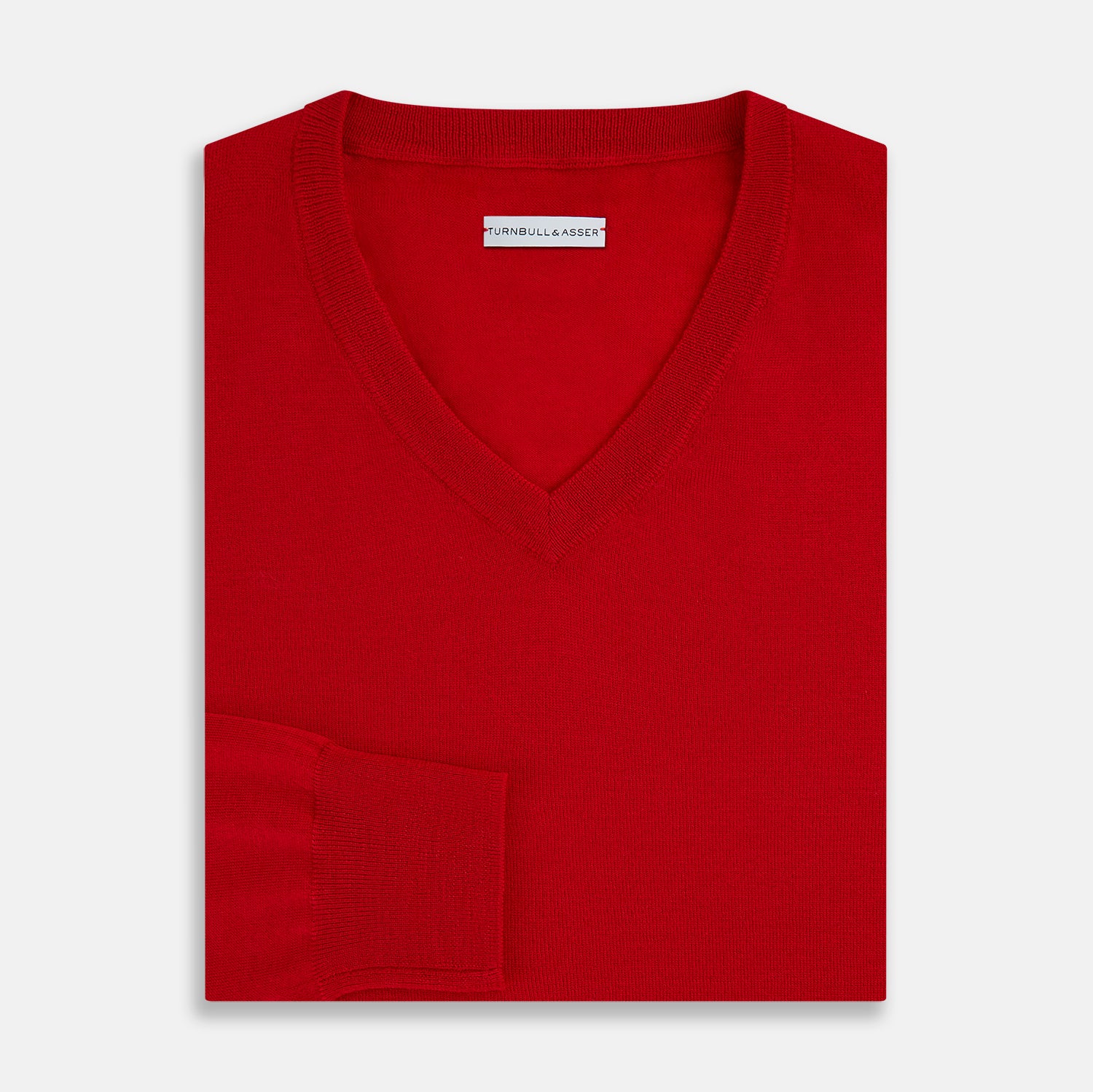 View 4 of product The Turnbull & Asser Red Fine Merino V-Neck Jumper, a classic long-sleeve knitwear piece, is shown on a white background.
