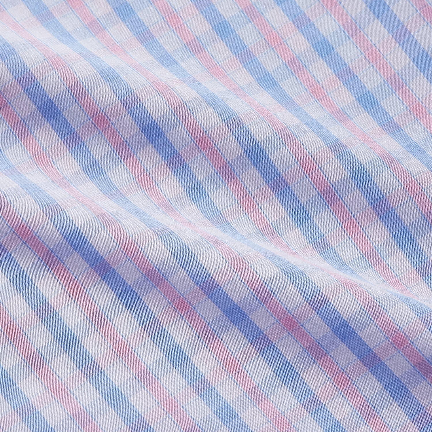 View 4 of product The Turnbull & Asser Red and Blue Multi Check Cotton RE-PURPOSE Mayfair shirt is a sustainable, long-sleeve button-up with a collar and cuffed sleeves, crafted from recycled fabrics and shown laid flat on a white background.