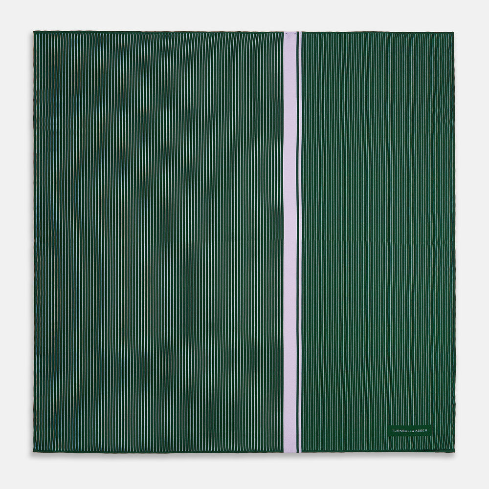 The Forest Green and Lilac Stripe Silk Pocket Square by Turnbull & Asser features thin white pinstripes, a bold light purple vertical stripe, and a visible branded label for classic British elegance. One corner is neatly folded over.
