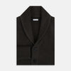 View 4 of product The Turnbull & Asser Dark Brown Cashmere Shawl Collar Cardigan features a ribbed knit, five black front buttons, and two front pockets, highlighting handcrafted quality against a white background.