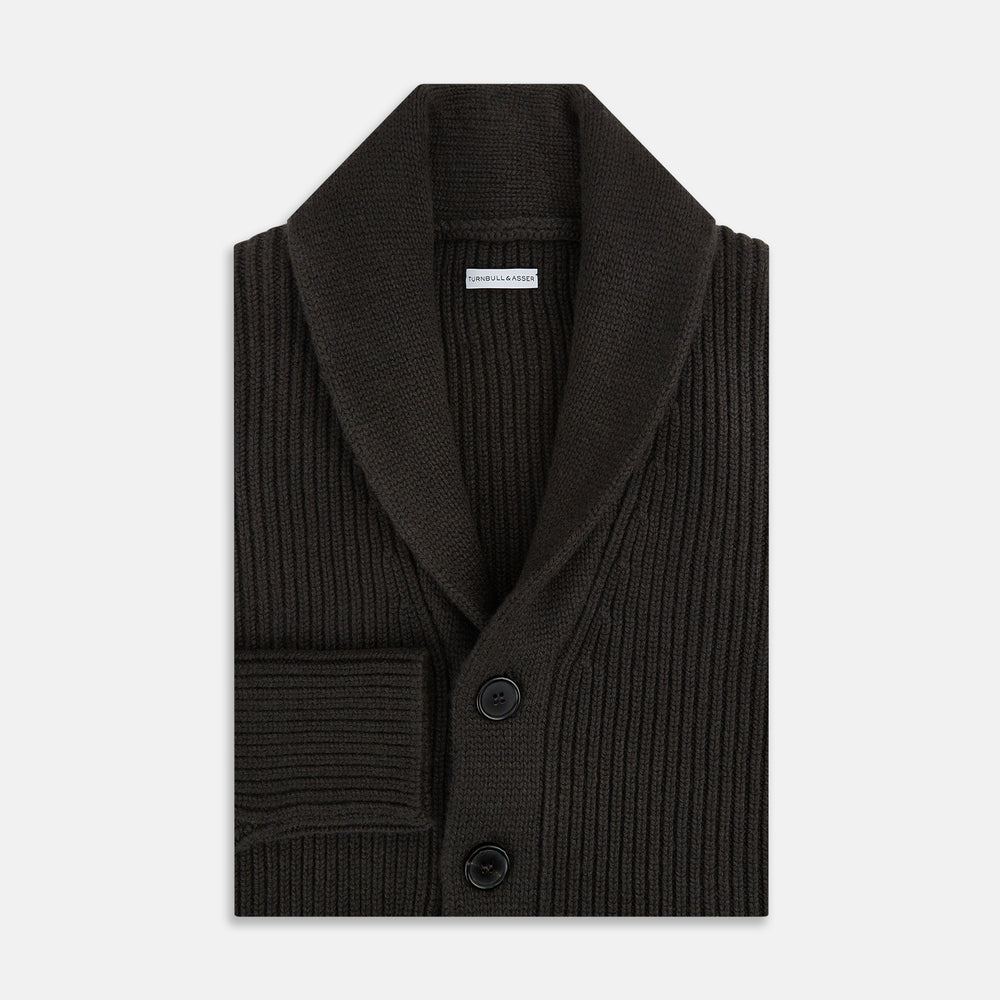 The Turnbull & Asser Dark Brown Cashmere Shawl Collar Cardigan features a ribbed knit, five black front buttons, and two front pockets, highlighting handcrafted quality against a white background.