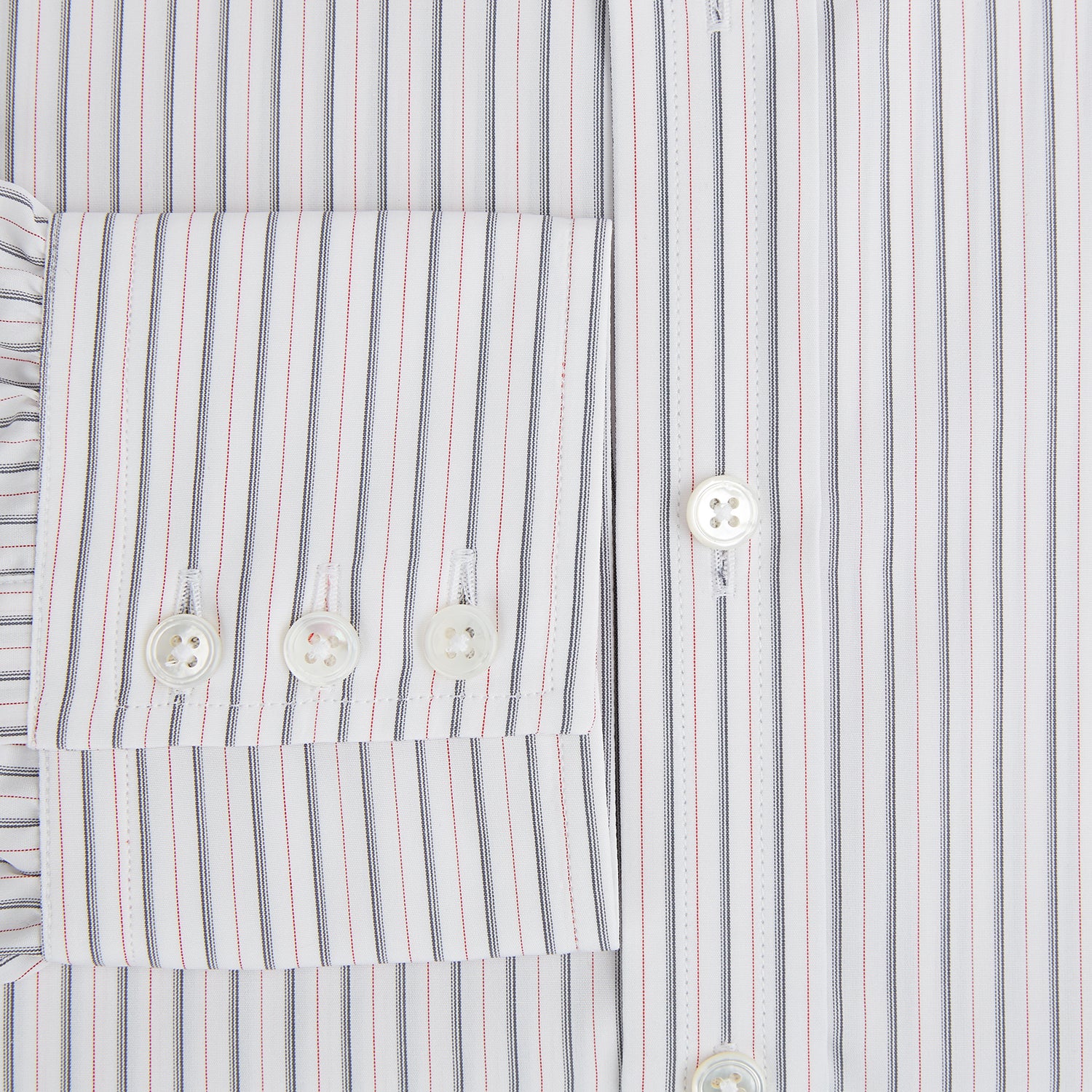 View 4 of product The Turnbull & Asser Midnight Blue and Red Ticking Stripe Mayfair Shirt features long sleeves, a pointed collar, buttoned cuffs, and fine Italian cotton—an essential men's wardrobe piece shown on a plain white background.