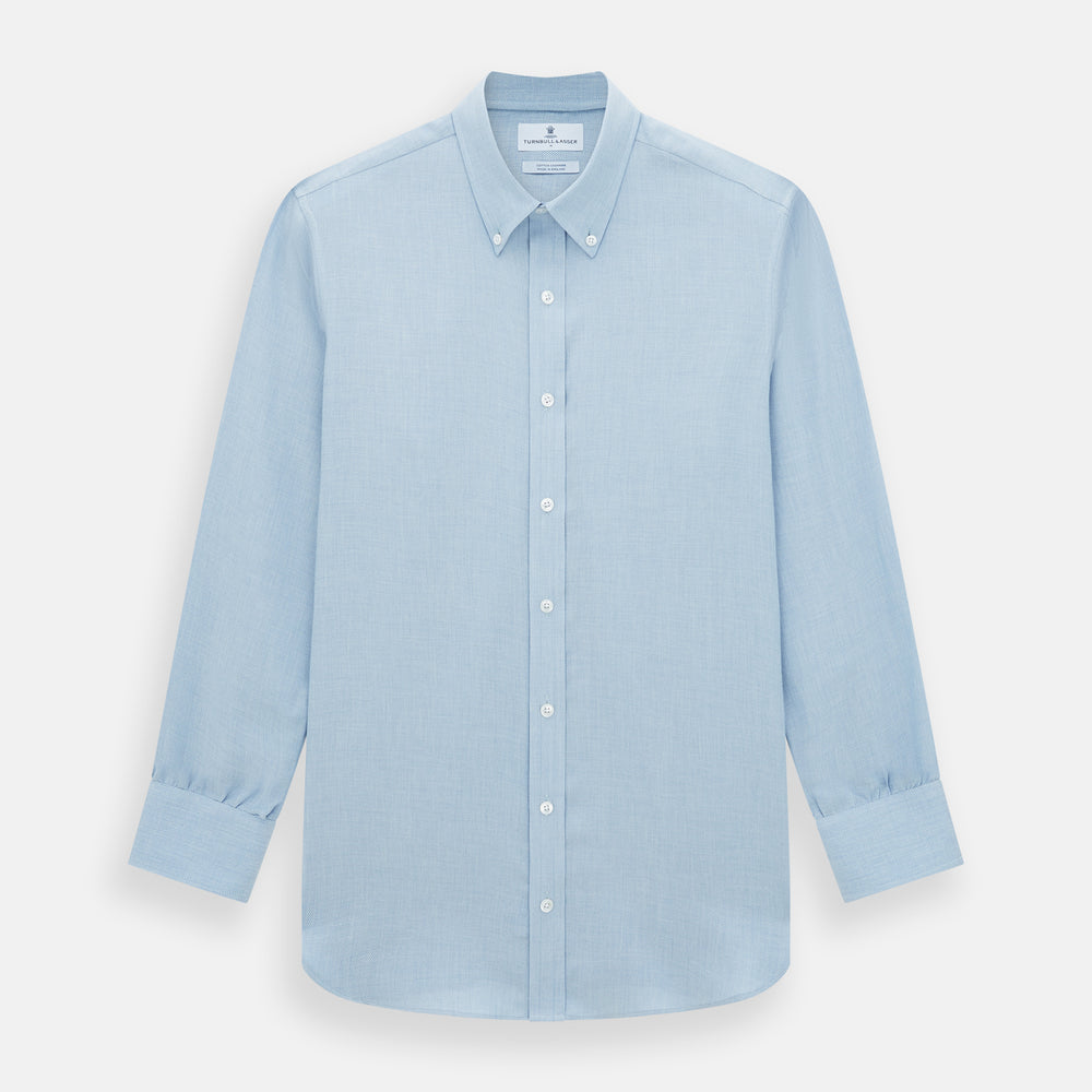 The Turnbull & Asser Pale Blue Cotton Cashmere Dorset Collar Richmond Shirt features long sleeves, a button-down collar, white buttons, and a chest pocket. It is neatly displayed flat on a white background.