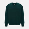 View 1 of product The Turnbull & Asser Forest Green Cashmere V-neck Jumper features ribbed cuffs and hem, shown against a white background—an essential knitwear staple for any wardrobe.