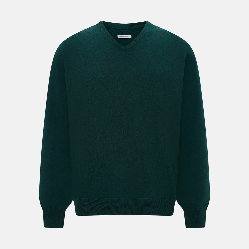 The Turnbull & Asser Forest Green Cashmere V-neck Jumper features ribbed cuffs and hem, shown against a white background—an essential knitwear staple for any wardrobe.