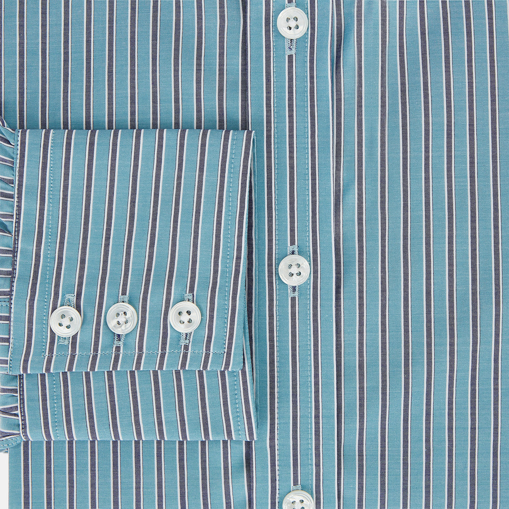 The Turnbull & Asser Turquoise Ticking Stripe Mayfair Shirt is a long-sleeve, button-up shirt in fine Italian cotton with light blue and white stripes, a collar, white buttons, curved hem, and subtle turquoise ticking stripe.