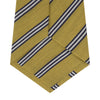 View 4 of product The Turnbull & Asser GGT92000 3042 11 OS is a classic yellow necktie with diagonal black and white stripes, rolled elegantly on a white background.