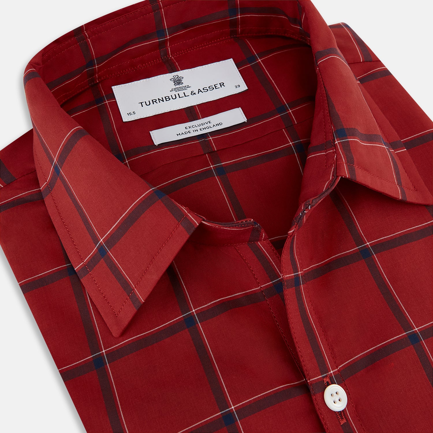 View 2 of product The Turnbull & Asser Dark Red Grid Check Windsor Shirt is a long-sleeved, button-up shirt with a dark red base and black and white grid pattern, displayed flat on a white background.