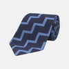 View 1 of product The Turnbull & Asser Navy and Light Blue Striped Zigzag Silk Tie features a striking zigzag pattern—a stylish accessory for the modern gentleman.