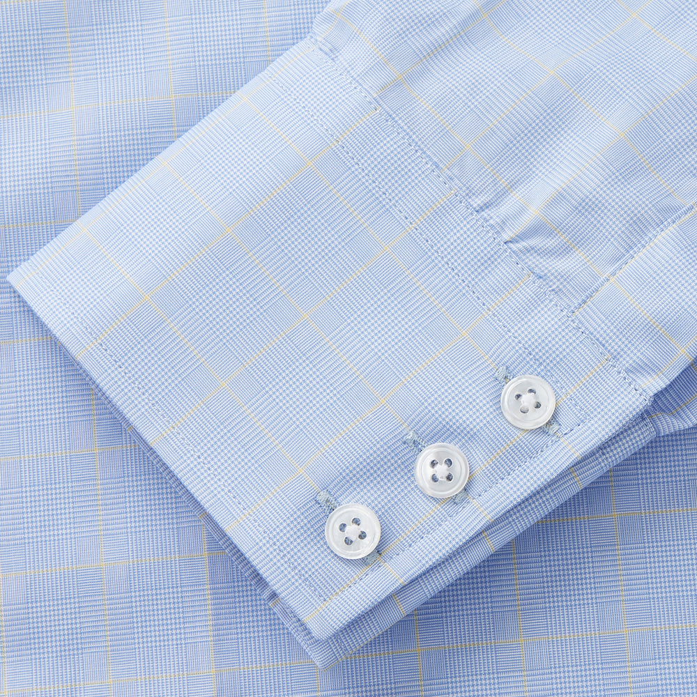 A Turnbull & Asser Yellow and Blue Prince of Wales Check Mayfair Shirt with white buttons and a classic collar, laid flat on a white background.