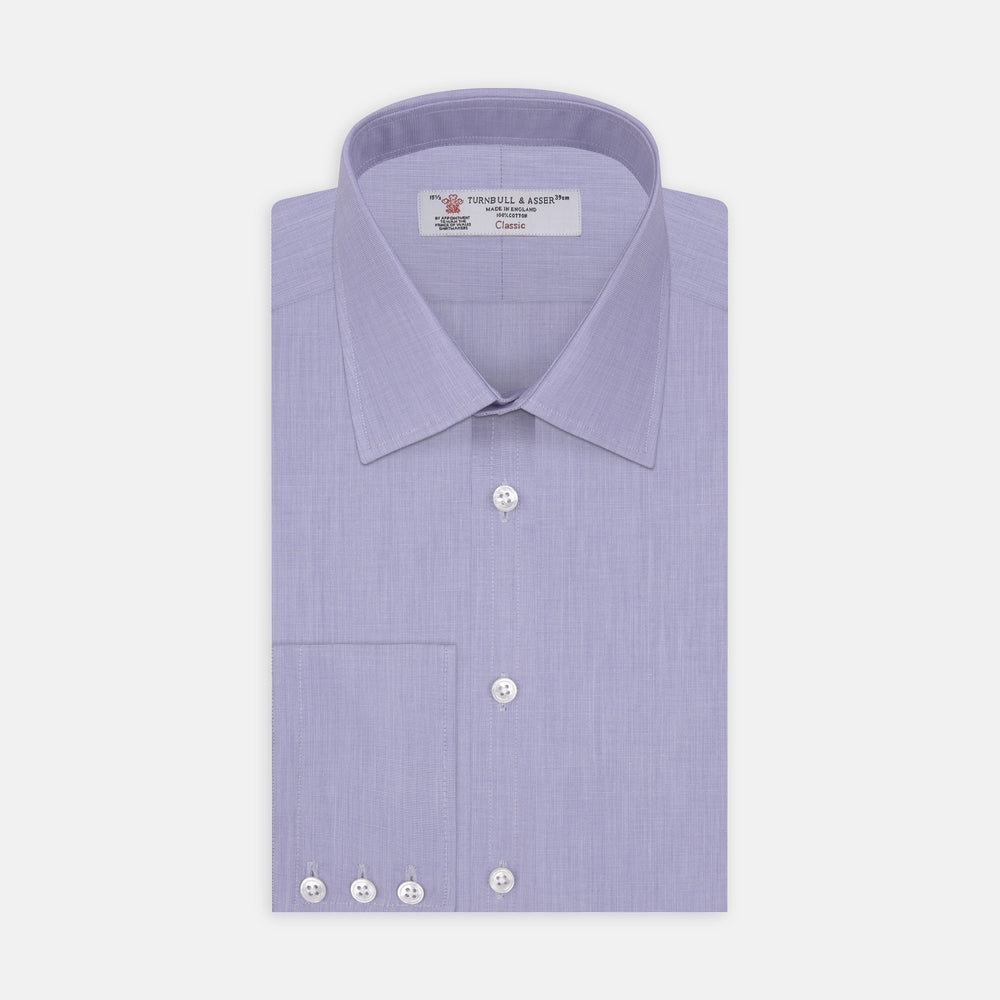 A circular swatch of Turnbull & Asser's Blue End-on-End Cotton Fabric, featuring a fine blue and white grid pattern with a thin gray border on a plain white background.