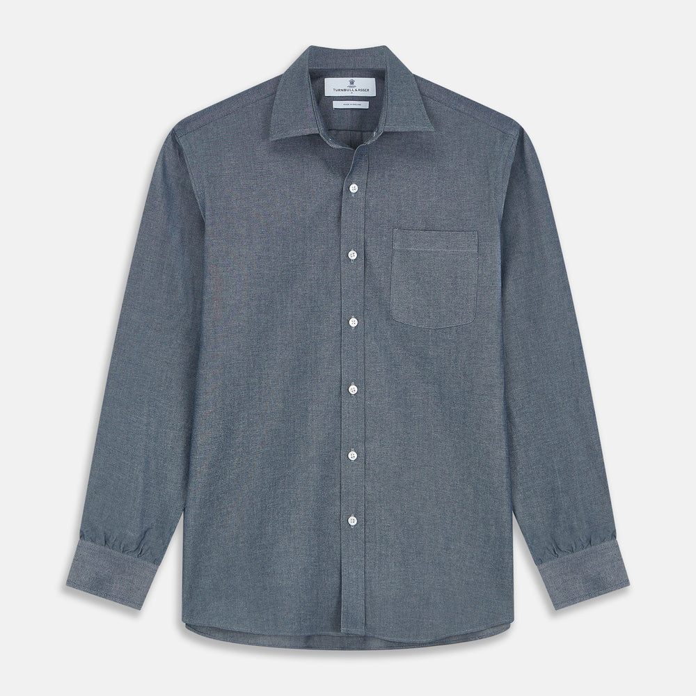 The Turnbull & Asser Blue Weekend Fit Oxford Finch Shirt features a Derby collar, chest pocket, white buttons, and classic fit—part of the Weekend Fit shirts collection—laid flat on a white background.