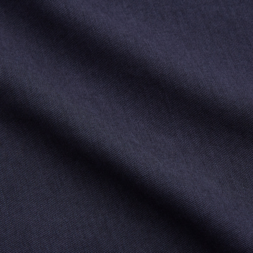 The Turnbull & Asser Navy Military Weekend Fit Shirt features a stand collar, black buttons, dual chest flap pockets, and 1-button cuffs in Italian cotton-wool, shown laid flat on a white background.