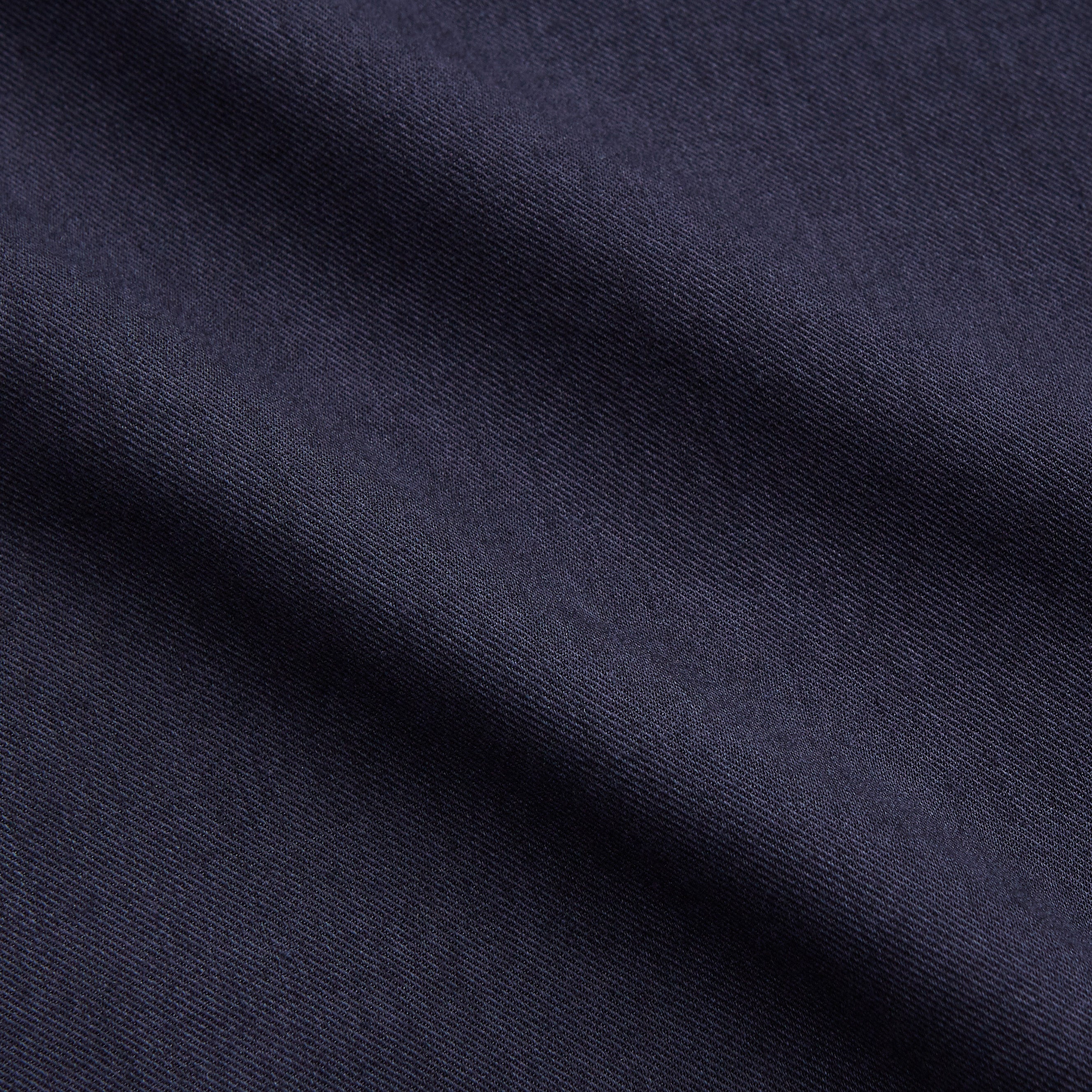 View 4 of product The Turnbull & Asser Navy Military Weekend Fit Shirt features a stand collar, black buttons, dual chest flap pockets, and 1-button cuffs in Italian cotton-wool, shown laid flat on a white background.