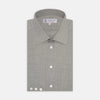 View 1 of product The Turnbull & Asser Grey Cashmere Blend Shirt features a T&A collar, 3-button cuffs, and a front pocket, shown neatly folded with white buttons against a plain white background.