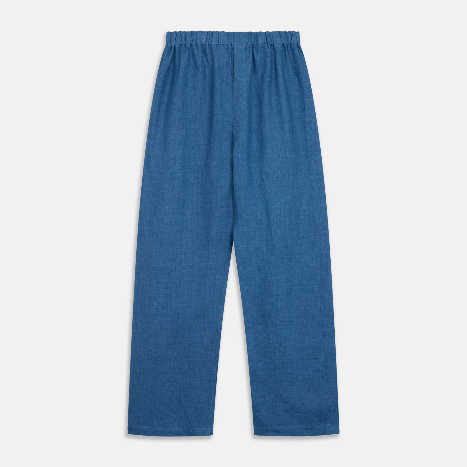 View 8 of product A person stands barefoot against a plain background, wearing the Teal Linen Modern Pyjama Set from Turnbull & Asser.