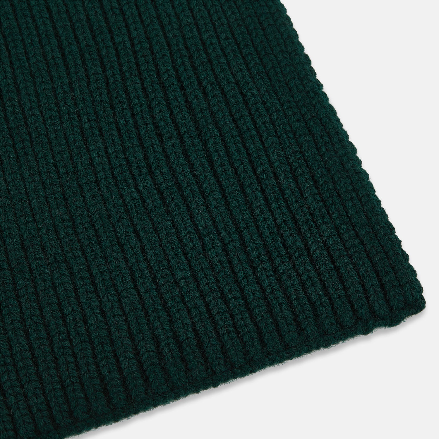 View 2 of product The Turnbull & Asser Forest Green Rib-Knit Cashmere Scarf is shown neatly looped and ribbed, set against a plain white background.