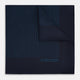 The Navy and Blue Stripe Silk Pocket Square by Turnbull & Asser features vertical blue pinstripes, is crafted from silk with hand-rolled edges, and is finished with the brand's logo printed in blue at the lower right corner.