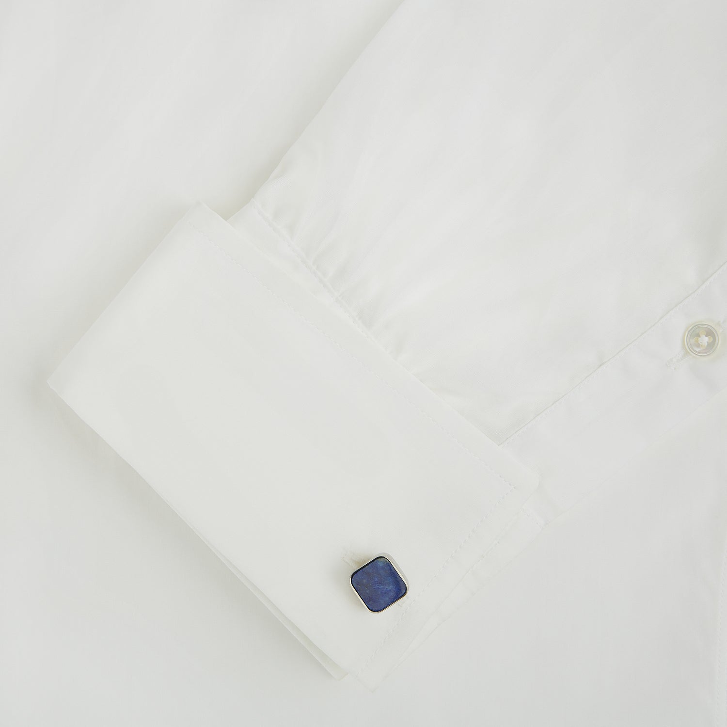 View 3 of product Turnbull & Asser Lapis Lazuli Square Cufflinks feature sterling silver settings and vibrant blue lapis lazuli inlays with gold flecks, shown on a white background.