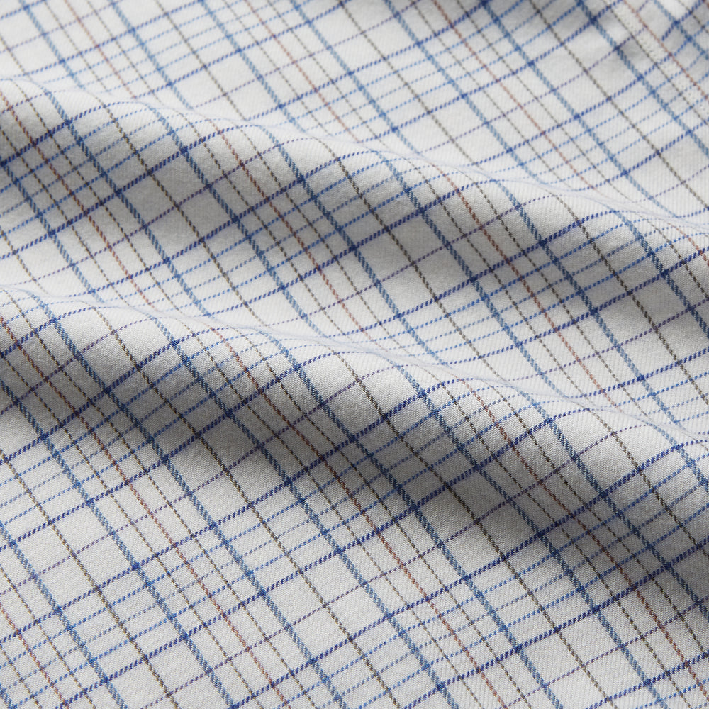 The Turnbull & Asser Blue Multi Check Regular Fit Cotton-Cashmere Shirt features a T&A collar, 3 button cuffs, and a white background with tonal blue and light brown checks—shown flat against a white background.