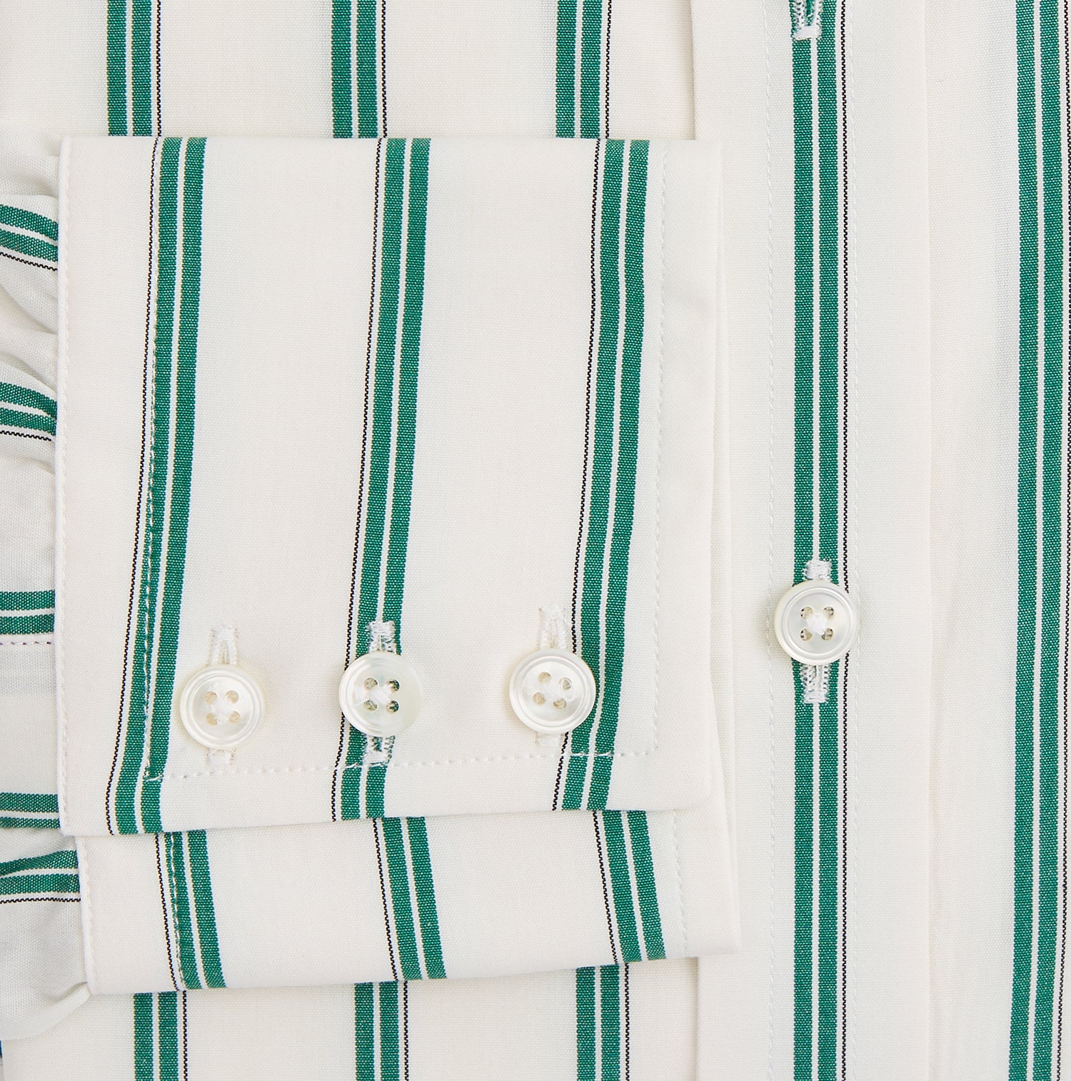 View 4 of product Elevate your wardrobe with the Turnbull & Asser Green Double Track Stripe Mayfair Shirt, crafted from soft organic cotton with a white base, classic collar, and buttoned cuffs—shown against a plain white background.